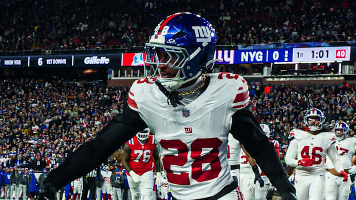 Dec 1, 2025; Foxborough, Massachusetts, USA; New England Patriots wide receiver Kayshon Boutte (9) catches a pass for a touchdown against New York Giants cornerback Cor'Dale Flott (28) during the first quarter at Gillette Stadium. Mandatory Credit: David Butler II-Imagn Images