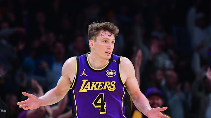 Nov 19, 2024; Los Angeles, California, USA; Los Angeles Lakers guard Dalton Knecht (4) reacts after scoring a three point basket against the Utah Jazz during the second half at Crypto.com Arena. Mandatory Credit: Gary A. Vasquez-Imagn Images