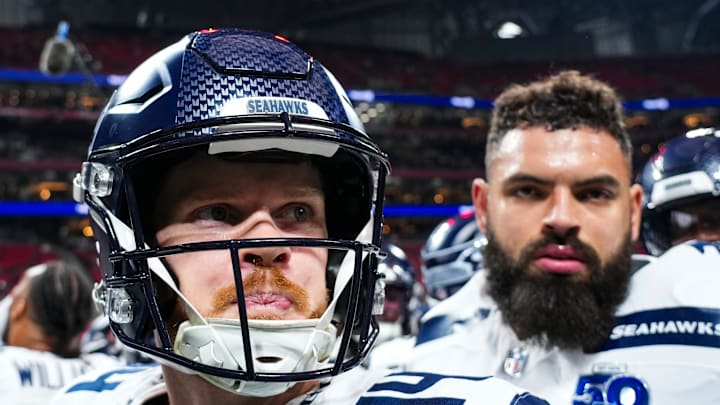 Sam Darnold and Abe Lucas of the Seattle Seahawks Sam Darnold and Abe Lucas of the Seattle Seahawks