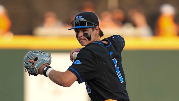 Kentucky infielder Tyler Bell (6) throws the ball to first base after getting Tennessee infielder Andrew Fischer (11) out at second base during a NCAA baseball game between Tennessee and Kentucky at Lindsey Nelson Stadium in Knoxville, Tenn., on April 18, 2025. Kentucky infielder Tyler Bell (6) throws the ball to first base after getting Tennessee infielder Andrew Fischer (11) out at second base during a NCAA baseball game between Tennessee and Kentucky at Lindsey Nelson Stadium in Knoxville, Tenn., on April 18, 2025.