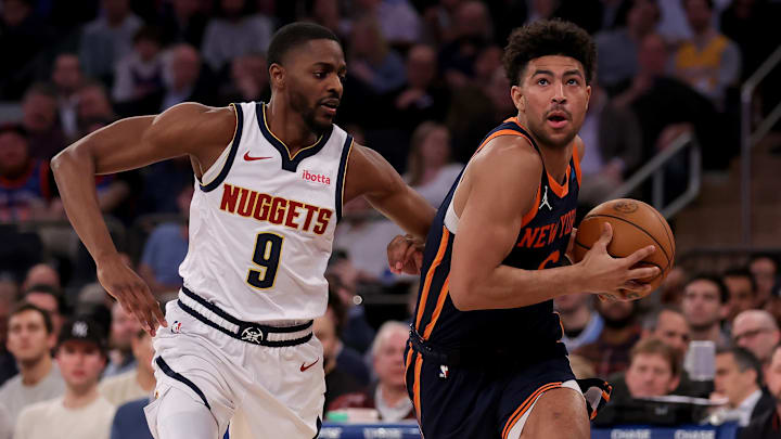 Jan 25, 2024; New York, New York, USA; New York Knicks guard Quentin Grimes (6) drives to the basket against Denver Nuggets forward Justin Holiday (9) during the fourth quarter at Madison Square Garden. Mandatory Credit: Brad Penner-Imagn Images