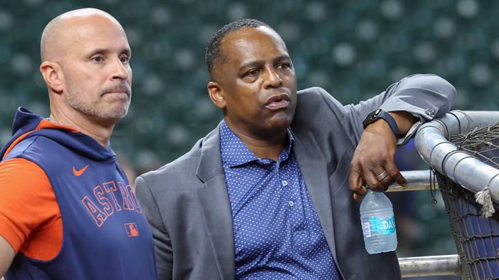 Jun 28, 2025; Houston, Texas, USA; Houston Astros manager Joe Espada (left) and general manager Dana Brown (right) talk on the field before the game against the Chicago Cubs at Daikin Park. Mandatory Credit: Troy Taormina-Imagn Images