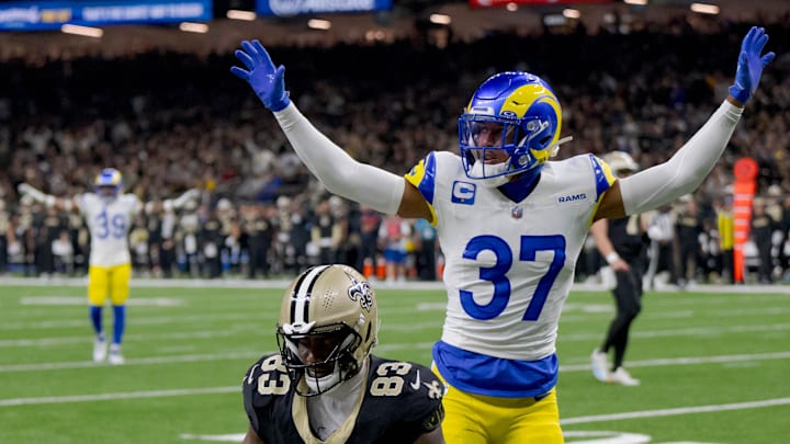 Dec 1, 2024; New Orleans, Louisiana, USA; New Orleans Saints tight end Juwan Johnson (83) is prevented from making a catch by Los Angeles Rams safety Quentin Lake (37) during the first half at Caesars Superdome. Mandatory Credit: Matthew Hinton-Imagn Images Dec 1, 2024; New Orleans, Louisiana, USA; New Orleans Saints tight end Juwan Johnson (83) is prevented from making a catch by Los Angeles Rams safety Quentin Lake (37) during the first half at Caesars Superdome. Mandatory Credit: Matthew Hinton-Imagn Images