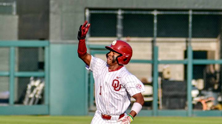 Oklahoma outfielder Jason Walk celebrates after hitting a home run against Tennessee.
