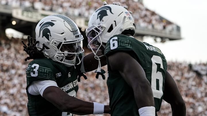 Aug 29, 2025; East Lansing, Michigan, USA; Michigan State Spartans wide receivers Nick Marsh (6) and Rodney Bullard Jr. (3) celebrate a touchdown during the second quarter at Spartan Stadium. Mandatory Credit: Brendan Mullin-Imagn Images
