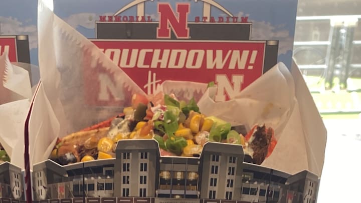Nachos served in a box with a cardboard cutout of Memorial Stadium is one enhanced packaging option at Husker concession stands this fall.