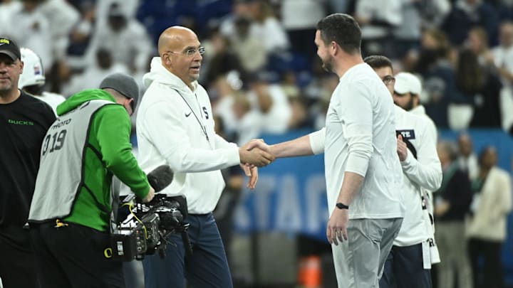 Dec 7, 2024; Indianapolis, IN, USA; Penn State Nittany Lions head coach James Franklin shakes hands with Oregon Ducks head coach Dan Lanning in the 2024 Big Ten Championship game at Lucas Oil Stadium.