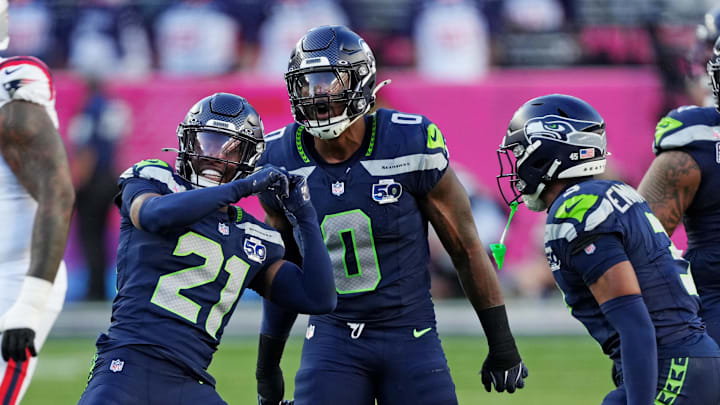 Seattle Seahawks defensive end DeMarcus Lawrence and cornerback Devon Witherspoon react after a play against the New England Patriots in Super Bowl LX