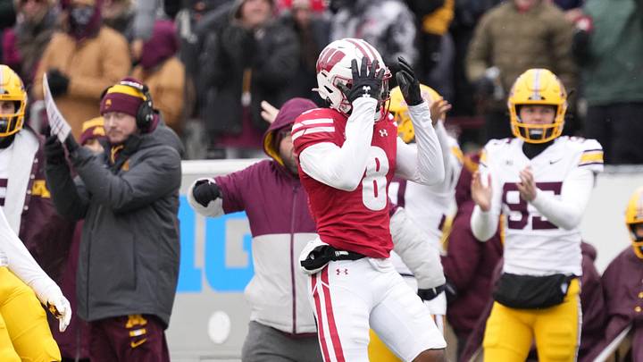 Nov 29, 2024; Madison, Wisconsin, USA;  Wisconsin Badgers wide receiver Vinny Anthony II (8) reacts after missing a catch during the third quarter against the Minnesota Golden Gophers at Camp Randall Stadium. Mandatory Credit: Jeff Hanisch-Imagn Images