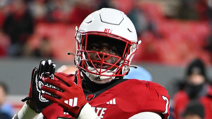 Nov 25, 2023; Raleigh, North Carolina, USA;  North Carolina State Wolfpack offensive lineman Anthony Carter Jr. (75) warms up prior to a game against the North Carolina Tar Heels at Carter-Finley Stadium. Mandatory Credit: Rob Kinnan-Imagn Images