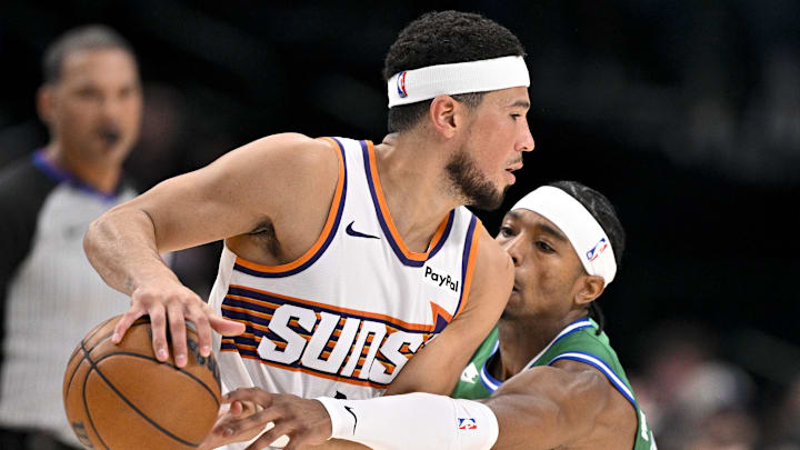 Nov 12, 2025; Dallas, Texas, USA; Dallas Mavericks guard Brandon Williams (10) steals the ball from Phoenix Suns guard Devin Booker (1) during the second quarter at the American Airlines Center. Mandatory Credit: Jerome Miron-Imagn Images Nov 12, 2025; Dallas, Texas, USA; Dallas Mavericks guard Brandon Williams (10) steals the ball from Phoenix Suns guard Devin Booker (1) during the second quarter at the American Airlines Center. Mandatory Credit: Jerome Miron-Imagn Images