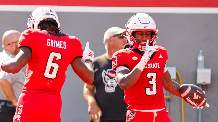 Oct 4, 2025; Raleigh, North Carolina, USA; NC State Wolfpack running back Hollywood Smothers (3) and wide receiver Wesley Grimes (6) celebrate a touchdown during the first half of the game against Campbell Fighting Camels at Carter-Finley Stadium. Mandatory Credit: Jaylynn Nash-Imagn Images Oct 4, 2025; Raleigh, North Carolina, USA; NC State Wolfpack running back Hollywood Smothers (3) and wide receiver Wesley Grimes (6) celebrate a touchdown during the first half of the game against Campbell Fighting Camels at Carter-Finley Stadium. Mandatory Credit: Jaylynn Nash-Imagn Images