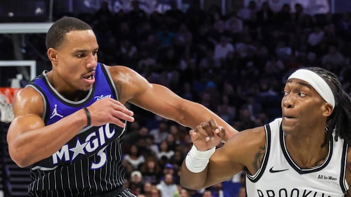 Brooklyn Nets guard Terance Mann drives around Orlando Magic guard Desmond Bane. Brooklyn Nets guard Terance Mann drives around Orlando Magic guard Desmond Bane.