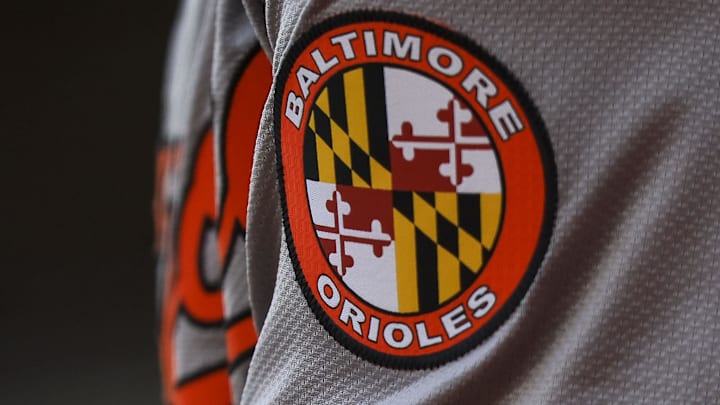 May 5, 2024; Cincinnati, Ohio, USA; The Baltimore Orioles logo on the sleeve of designated hitter Gunnar Henderson (2) as he prepares on deck during the seventh inning against the Cincinnati Reds at Great American Ball Park. 