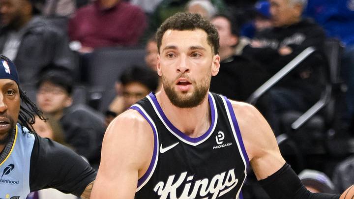 Feb 4, 2026; Sacramento, California, USA; Sacramento Kings guard Zach LaVine (8) dribbles past Memphis Grizzlies guard Kentavious Caldwell-Pope (3) during the third quarter at Golden 1 Center. Mandatory Credit: Ed Szczepanski-Imagn Images
