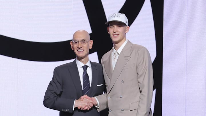 Jun 25, 2025; Brooklyn, NY, USA;  Egor Demin stands with NBA commissioner Adam Silver after being selected as the eighth pick by the Brooklyn Nets in the first round of the 2025 NBA Draft at Barclays Center. Mandatory Credit: Brad Penner-Imagn Images
