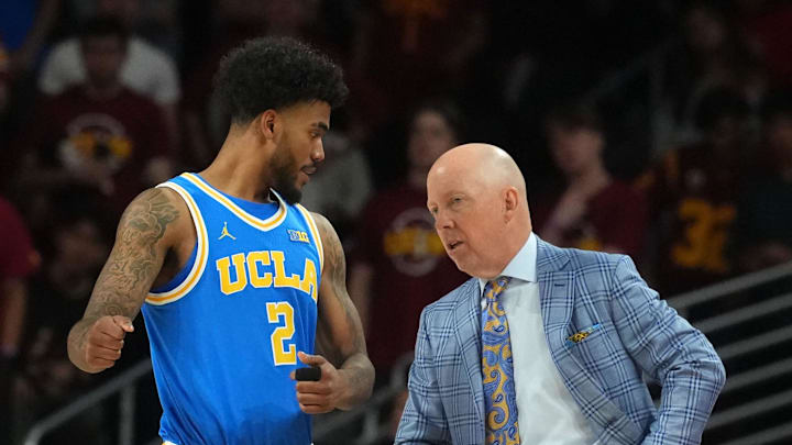 Mar 7, 2026; Los Angeles, California, USA; UCLA Bruins guard Donovan Dent (2) talks with head coach Mick Cronin against the Southern California Trojans first half at Galen Center. Mandatory Credit: Kirby Lee-Imagn Images