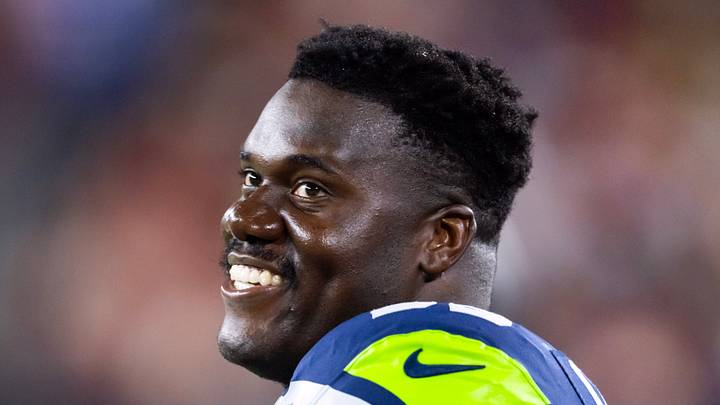 Seattle Seahawks center Olu Oluwatimi smiles on the field
