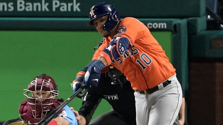 Nov 3, 2022; Philadelphia, Pennsylvania, USA; Houston Astros first baseman Yuli Gurriel (10) hits a double against the Philadelphia Phillies during the seventh inning in game five of the 2022 World Series at Citizens Bank Park. 