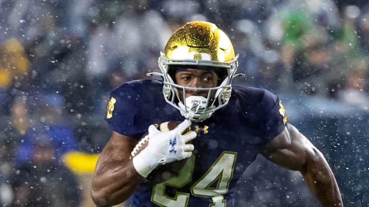 Notre Dame Fighting Irish running back Jadarian Price runs the ball against the Navy Midshipmen.