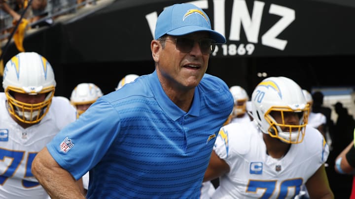 Sep 22, 2024; Pittsburgh, Pennsylvania, USA;  Los Angeles Chargers head coach Jim Harbaugh leads his team onto the field to play the Pittsburgh Steelers at Acrisure Stadium. Mandatory Credit: Charles LeClaire-Imagn Images