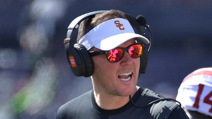 Sep 27, 2025; Champaign, Illinois, USA;  Southern California Trojans head coach Lincoln Riley talks with players during the first half against the Illinois Fighting Illini  at Memorial Stadium. Mandatory Credit: Ron Johnson-Imagn Images