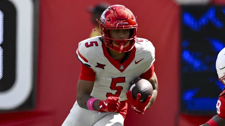 Oct 18, 2025; Houston, Texas, USA; Arizona Wildcats wide receiver Gio Richardson (5) runs the ball during the first half against the Houston Cougars at TDECU Stadium. Mandatory Credit: Maria Lysaker-Imagn Images 
