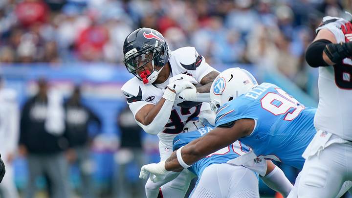Houston Texans running back David Montgomery (32) is tackled by Tennessee Titans linebacker Cody Barton (50) during the first quarter at Nissan Stadium in Nashville, Tenn., Sunday, Oct. 11, 2026. Houston Texans running back David Montgomery (32) is tackled by Tennessee Titans linebacker Cody Barton (50) during the first quarter at Nissan Stadium in Nashville, Tenn., Sunday, Oct. 11, 2026.