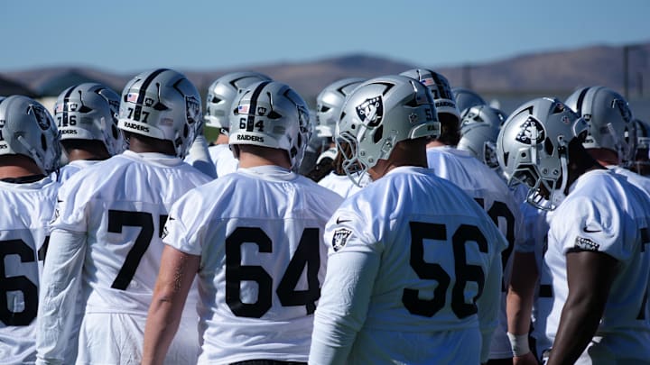 Jul 24, 2025; Henderson, NV, USA; Las Vegas Raiders players huddle during training camp at the Intermountain Healthcare Performance Center. Mandatory Credit: Kirby Lee-Imagn Images