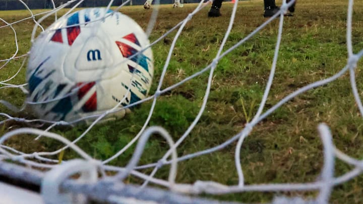 A goal scored by Wolfson's Raphael Eccher (9), not visibly seen has South Walton's goalkeeper Graham Wilde (1) looking back at the net during the first half of the FHSAA Region 1-3A high school boys soccer final Wednesday, Feb. 19, 2025 at Wolfson High School in Jacksonville, Fla.