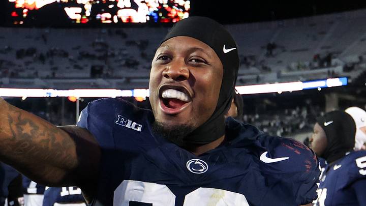 Nov 22, 2025; University Park, Pennsylvania, USA; Penn State Nittany Lions defensive end Zuriah Fisher (36) holds up a Hire Terry Smith sign following the game against the Nebraska Cornhuskers at Beaver Stadium. Mandatory Credit: Matthew O'Haren-Imagn Images