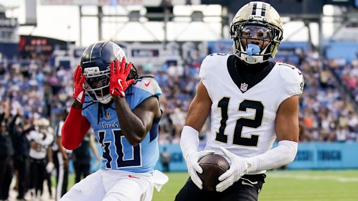 Tennessee Titans cornerback Kemon Hall (40) reacts as New Orleans Saints wide receiver Chris Olave (12) brings in a touchdown during the third quarter at Nissan Stadium in Nashville, Tenn., Sunday, Dec. 28, 2025.