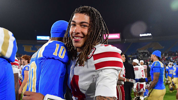  TJ Lateef meets with UCLA Bruins quarterback Madden Iamaleava following the game at the Rose Bowl.