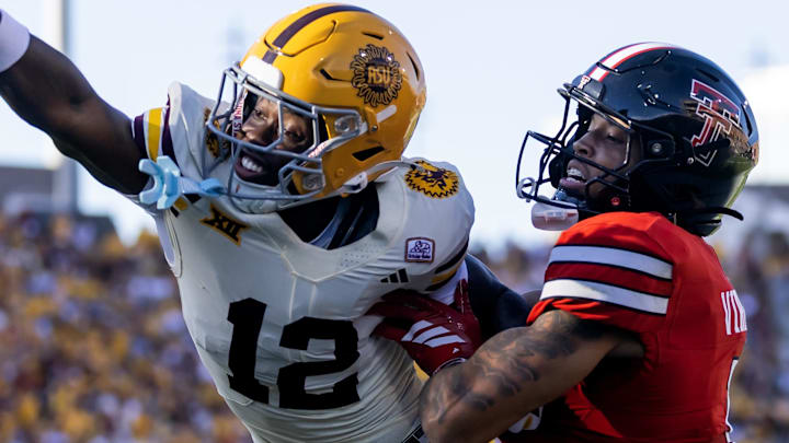 Oct 18, 2025; Tempe, Arizona, USA; Arizona State Sun Devils defensive back Javan Robinson (12) breaks up a pass to Texas Tech Red Raiders wide receiver Kelby Valsin
at Mountain America Stadium. Mandatory Credit: Mark J. Rebilas-Imagn Images