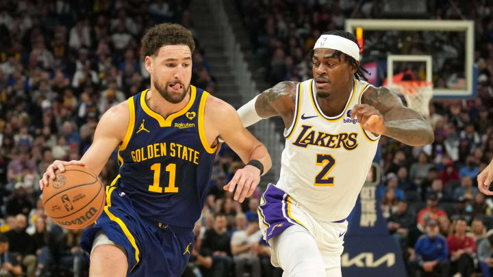 Jan 27, 2024; San Francisco, California, USA; Golden State Warriors guard Klay Thompson (11) dribbles against Los Angeles Lakers forward Jarred Vanderbilt (2) during the fourth quarter at Chase Center. Mandatory Credit: Darren Yamashita-USA TODAY Sports