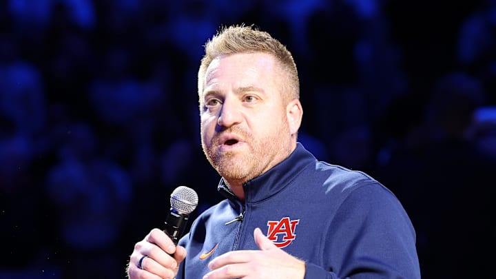 Dec 3, 2025; Auburn, Alabama, USA; Auburn Tigers head football coach Alex Golesh is introduced during the first half of a basketball game between the Auburn Tigers and NC State Wolfpack at Neville Arena. Mandatory Credit: John Reed-Imagn Images