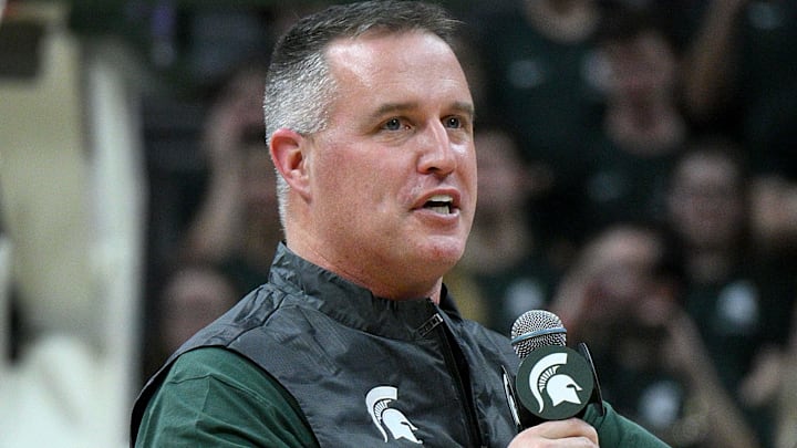 Dec 2, 2025; East Lansing, Michigan, USA;  Michigan State head football coach Pat Fitzgerald watches the Spartans defeat the Iowa Hawkeyes at Jack Breslin Student Events Center. Mandatory Credit: Dale Young-Imagn Images