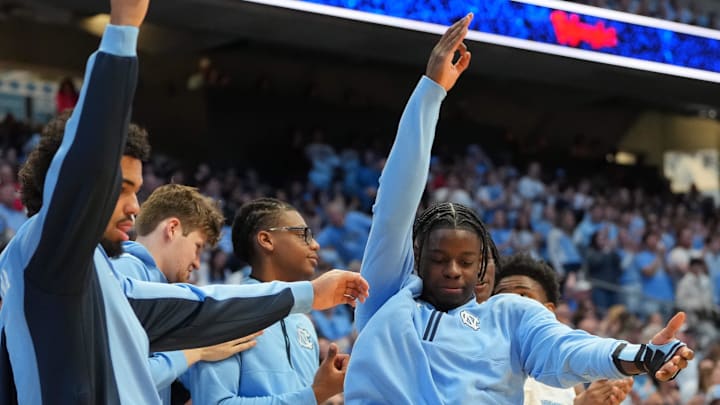Feb 14, 2026; Chapel Hill, North Carolina, USA; North Carolina Tar Heels guard Isaiah Denis (5) and forward Caleb Wilson (8) react on the bench in the second half at Dean E. Smith Center. Mandatory Credit: Bob Donnan-Imagn Images Feb 14, 2026; Chapel Hill, North Carolina, USA; North Carolina Tar Heels guard Isaiah Denis (5) and forward Caleb Wilson (8) react on the bench in the second half at Dean E. Smith Center. Mandatory Credit: Bob Donnan-Imagn Images