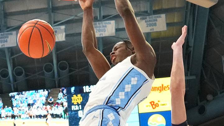 Jan 21, 2026; Chapel Hill, North Carolina, USA; North Carolina Tar Heels forward Caleb Wilson (8) dunks the ball as Notre Dame Fighting Irish forward Garrett Sundra (12) and forward Brady Koehler (6) defend in the second half at Dean E. Smith Center. Mandatory Credit: Bob Donnan-Imagn Images Jan 21, 2026; Chapel Hill, North Carolina, USA; North Carolina Tar Heels forward Caleb Wilson (8) dunks the ball as Notre Dame Fighting Irish forward Garrett Sundra (12) and forward Brady Koehler (6) defend in the second half at Dean E. Smith Center. Mandatory Credit: Bob Donnan-Imagn Images