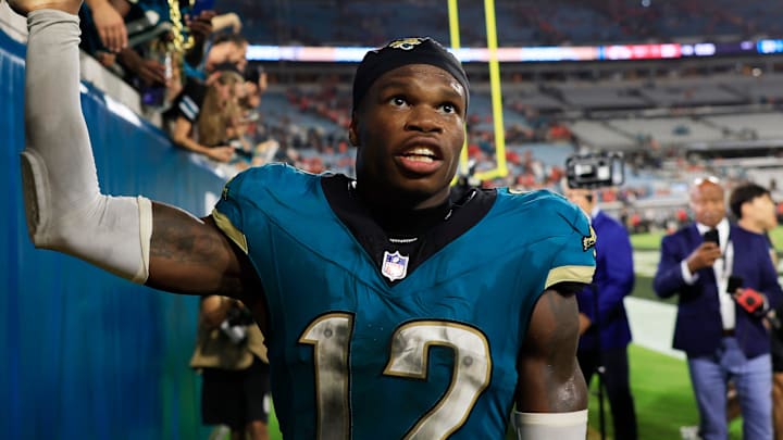 Jacksonville Jaguars wide receiver Travis Hunter (12) high-fives fans after the game of an NFL football matchup at EverBank Stadium, Monday, Oct. 6, 2025, in Jacksonville, Fla. The Jacksonville Jaguars edged the Kansas City Chiefs 31-28. [Corey Perrine/Florida Times-Union]