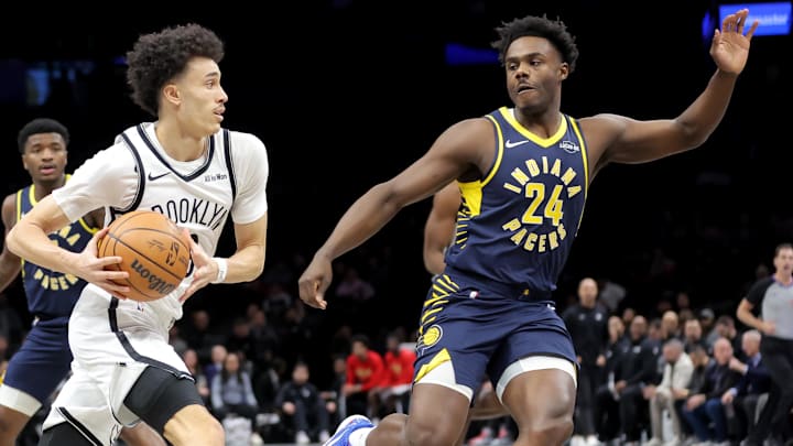 Feb 11, 2026; Brooklyn, New York, USA; Brooklyn Nets guard Nolan Traore (88) drives to the basket against Indiana Pacers guard Kobe Brown (24) during the first quarter at Barclays Center. Mandatory Credit: Brad Penner-Imagn Images