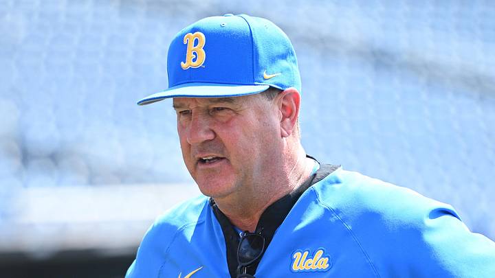 Jun 14, 2025; Omaha, Neb, USA;  UCLA Bruins head coach John Savage on the field before the game against the Murray State Races at Charles Schwab Field. Mandatory Credit: Steven Branscombe-Imagn Images