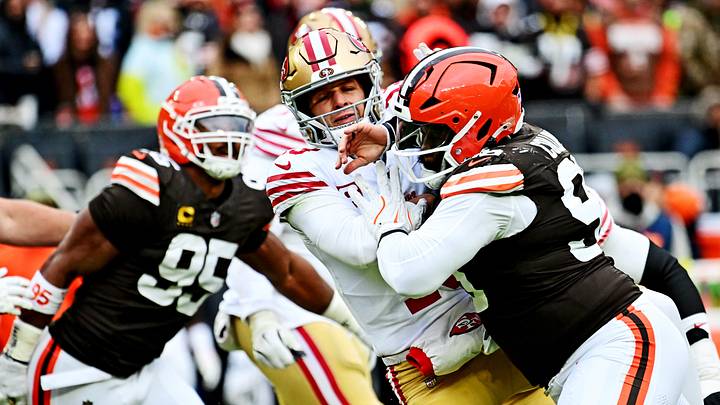 Nov 30, 2025; Cleveland, Ohio, USA;  San Francisco 49ers quarterback Brock Purdy (13) attempts to throw a pass during the second half against Cleveland Browns defensive tackle Maliek Collins (96) at Huntington Bank Field. Mandatory Credit: Ken Blaze-Imagn Images