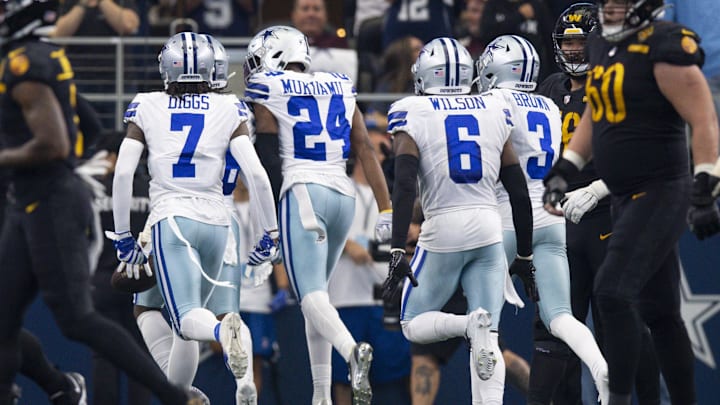 Dallas Cowboys DBs Trevon Diggs, Israel Mukuamu, Donovan Wilson, and Anthony Brown celebrate an interception by DaRon Bland against the Washington Commanders Dallas Cowboys DBs Trevon Diggs, Israel Mukuamu, Donovan Wilson, and Anthony Brown celebrate an interception by DaRon Bland against the Washington Commanders