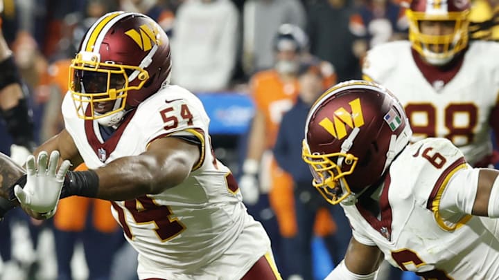 Nov 30, 2025; Landover, Maryland, USA; Denver Broncos tight end Evan Engram (1) runs with the ball as Washington Commanders linebacker Bobby Wagner (54) and Commanders cornerback Noah Igbinoghene (6) chase in the third quarter at Northwest Stadium. Mandatory Credit: Geoff Burke-Imagn Images