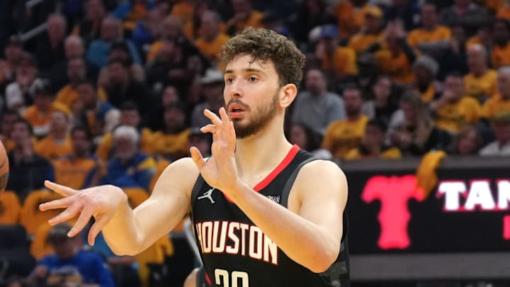Apr 26, 2025; San Francisco, California, USA; Houston Rockets center Alperen Sengun (28) passes against the Golden State Warriors during the second quarter of game three of first round for the 2024 NBA Playoffs at Chase Center. Mandatory Credit: Darren Yamashita-Imagn Images