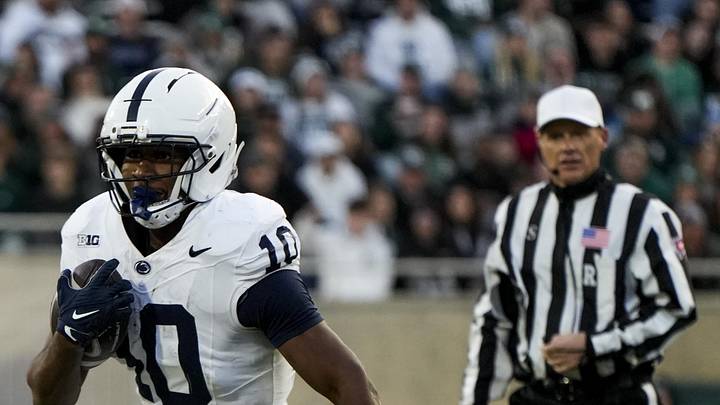 Nov 15, 2025; East Lansing, Michigan, USA; Penn State Nittany Lions running back Nicholas Singleton (10) runs for a first down in the second quarter against the Michigan State Spartans at Spartan Stadium. Mandatory Credit: Brendan Mullin-Imagn Images