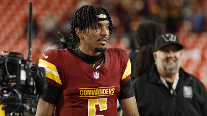 Dec 29, 2024; Landover, Maryland, USA; Washington Commanders quarterback Jayden Daniels (5) looks on while leaving the field after defeating the Atlanta Falcons at Northwest Stadium. Mandatory Credit: Amber Searls-Imagn Images