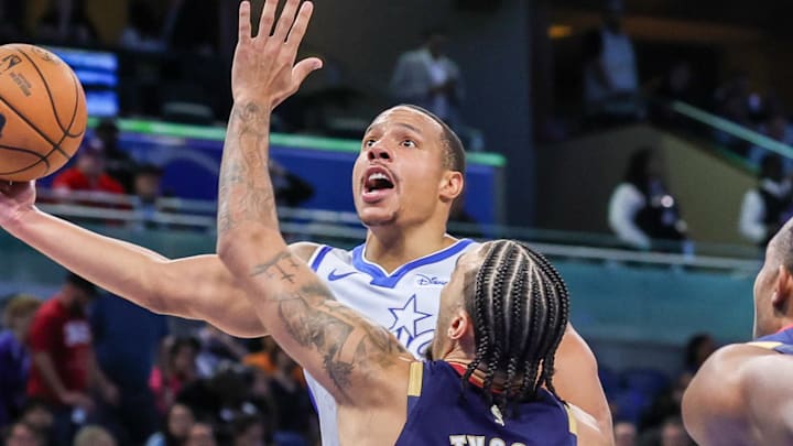 Mar 11, 2026; Orlando, Florida, USA; Orlando Magic guard Desmond Bane (3) goes to the basket against Cleveland Cavaliers guard Jaylon Tyson (20) during the second quarter at Kia Center. Mandatory Credit: Mike Watters-Imagn Images