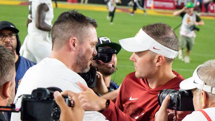 Oregon head coach Dan Lanning, left, shakes hands with USC head coach Lincoln Riley as the Oregon Ducks face the USC Trojans on Sept. 26, 2026, at Los Angeles Memorial Coliseum in Los Angeles, California. Oregon head coach Dan Lanning, left, shakes hands with USC head coach Lincoln Riley as the Oregon Ducks face the USC Trojans on Sept. 26, 2026, at Los Angeles Memorial Coliseum in Los Angeles, California.